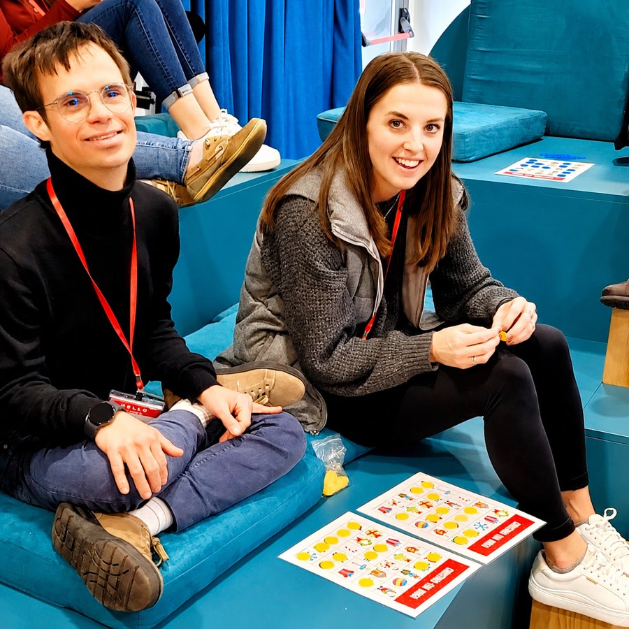 Two participants smiling during a Christmas bingo activity