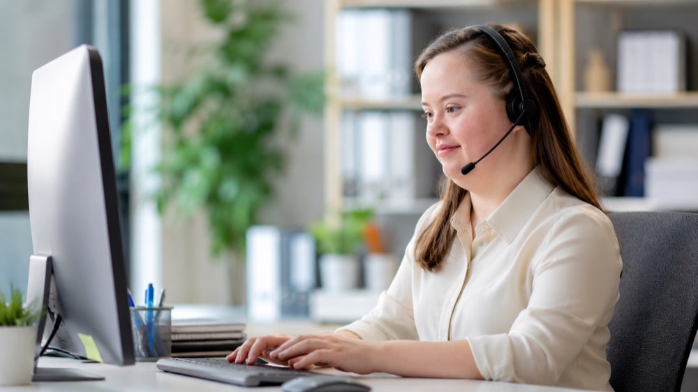 Person working in an office setting with a headset